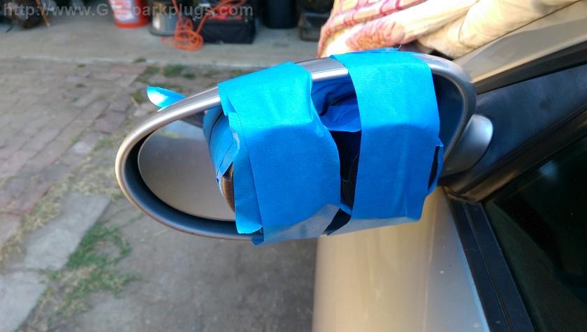 Securing the glued mirror